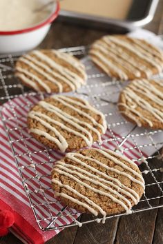 cookies with icing sitting on a cooling rack