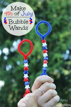 someone is holding up two red, white and blue beads with the words make 4th of july bubble wands