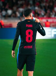 a man standing on top of a soccer field