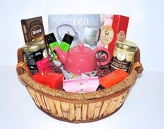 a basket filled with lots of different types of teas and confection items