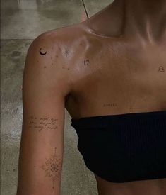 a woman with a tattoo on her left arm and the word love is written in cursive writing