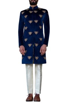 Navy blue achkan-style sherwani with all over hand embroidered motifs.
Components:1
Hand embroidered
Neckline:Mandarin collar
Sleeve Length:Full
Fabric:Velvet
Color:Blue
Single button on sleeve hem
Closure: Concealed front placket
Note: Safa and pants worn by the model is not for sale - Aza Fashions Designer Blue Nehru Jacket, Fitted Royal Blue Kurta With Zari Work, Designer Blue Bandhgala, Royal Festive Kurta For Eid, Fitted Royal Blue Traditional Kurta, Designer Blue Nehru Jacket With Intricate Embroidery, Royal Blue Traditional Wear With Dabka, Royal Bandhgala For Eid, Fitted Blue Nehru Jacket With Chikankari Embroidery