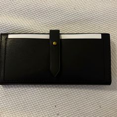 Brand New, Never Used Wallet With Protective Wrapping Black Bifold Coin Purse For Daily Use, Black Bifold Clutch With Card Slots, Black Clutch With Card Slots For Daily Use, Classic Black Wallet For Everyday Use, Classic Black Wallets For Everyday, Black Bifold Coin Purse For Everyday, Black Clutch With Coin Pocket For Daily Use, Chic Leather Card Holder For Everyday, Versatile Black Wallets For Everyday Use