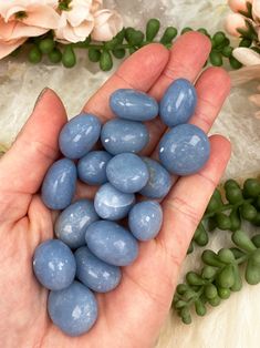 Tumbled Angelite is a stone full of calming and healing energy! These tumbles feature a soft yet vibrant blue coloring and are a good size for gridding or keeping with you on the go. Angelite is no surprise referred to as an angel stone and can promote peace and wisdom. This blue angelite is from Peru! Angelite is a soft stone, so while these are nicely polished, they do still have somewhat of a matte feel and will have minor scratches or dents. They are beautiful nonetheless! You will receive O Angelite Crystal Meaning, Angelite Aesthetic, Spiritual Tumbled Crystals For Meditation, Angellite Crystal Ring, Blue Mineral Crystal For Healing, Crystal Angelite, Okenite Crystal, Angelic Realm, Healing Properties