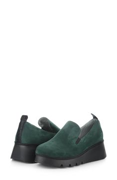 A sporty rubber wedge rewrites the casual-chic silhouette of a minimalist loafer crafted from velvety suede with gore insets and a heel tab for easy on/off. 2" heel Elastic gore insets Leather upper and lining/rubber sole Made in Portugal Wedge Loafers, Loafer Women, Fly London, Loafers For Women, On Off, Forest Green, Casual Chic, Slip On Sneaker, Rubber Sole