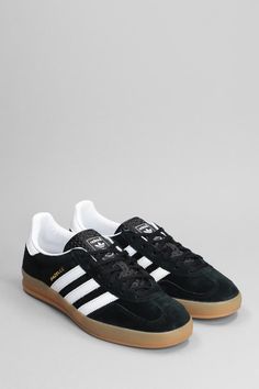 Gazelle Indoor Sneakers in black suede, laces, logo on tab, logo on heel, side bands, contrast detail, honey sole, rubber sole, 100% suede, Made in VietnamGender: WomenMaterial: SUEDEColor: BlackMade in: THProduct ID: 392314_H06259Unisex Fit: Sizes may vary. For accurate sizing, please contact our customer support team.*Import tax/duty will be calculated at checkout (If applicable) Black Suede Lace-up Sneakers, Suede Skate Shoes With Contrast Sole And Round Toe, Suede Skate Shoes With Contrast Sole, Suede Lace-up Sneakers With Translucent Outsole, Black Lace-up Skate Shoes With Rubber Heel Cap, Adidas Lace-up Skate Shoes With Rubber Sole, Suede Skate Shoes With Round Toe And Laces, Suede Sneakers With Rubber Heel Cap For Streetwear, Suede Skate Shoes With Laces And Round Toe