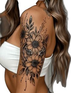 a woman's arm with sunflowers and leaves tattooed on the back of her body