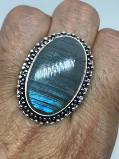 Vintage Blue Green Labradorite Stone Silver Ring https://www.etsy.com/listing/718463192/vintage-blue-green-labradorite-stone Vintage Labradorite Rings For Gift, Turquoise Moonstone Ring With Natural Stones As Gift, Vintage Moonstone Ring With Large Stone For Gift, Vintage Moonstone Ring With Large Stone As Gift, Blue Labradorite Rings For Gift, Blue Labradorite Rings As Gift, Blue Labradorite Rings For Gifts, Gift Blue Labradorite Rings, Army Rings