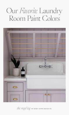 a white kitchen sink sitting under a window next to a counter top with a potted plant