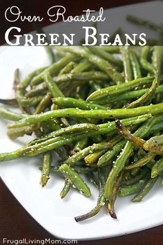 green beans on a white plate sitting on a table