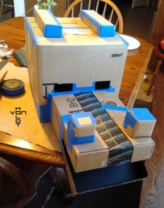 a cardboard box sitting on top of a wooden table