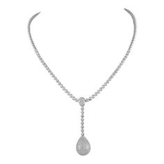 Exquisite diamond drop necklace. *Front half is with diamonds and the back half is not. 129 round brilliant diamonds, 1.39 carats total. Approximately F/G color and VVS2-VS1 clarity. Prong set in 18k white gold, 33.39 grams, and 17 inches. Accommodated with an up-to-date appraisal by a GIA G.G. once purchased, upon request. Please contact us with any questions. Fine Jewelry Platinum Pear-shaped Diamond Necklace, Platinum Pear-shaped Diamond Necklace, Diamond White Platinum Necklace In Pear Shape, Platinum Pear-shaped Necklace In Diamond White, Pear-shaped Platinum Necklace In Diamond White, Platinum Pear-shaped Diamond White Necklace, Pear-shaped Diamond Bridal Necklace In White Gold, Bridal White Gold Diamond Necklace In Pear Shape, Luxury Pave Set Drop Jewelry