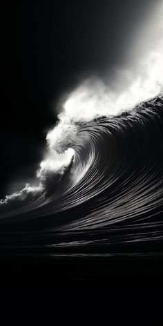 a black and white photo of a large wave