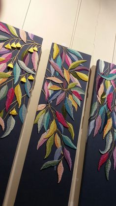 three paintings with leaves painted on them