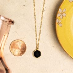 Black Onyx Dainty Hexagon Pendant Necklace - 14k Gold Filled, geometric, minimalist jewelry gifts for her, mom, girlfriend, sister, friend Stone: Genuine Black Onyx Gemstone: 11mm x 10mm Gold chain: 14k gold filled Chain length: 16-18 inches adjustable Clasp: spring ring Bezel: Vermeil Gold About "Gold Filled Jewelry": Also called rolled-gold. These jewelry items are not actually filled with gold. They are made of a base metal covered by sheets of gold in a mechanical bonding process. Effectivel Minimalist Gemstone Necklace For Mom, Minimalist Octagon Jewelry For Everyday, Minimalist Gemstone Necklace As A Gift For Mom, Minimalist Gemstone Necklace Gift For Mom, Minimalist Everyday Octagon Jewelry, Black Faceted Jewelry As A Gift, Sterling Silver Hexagon Jewelry As Gift, Sterling Silver Hexagon Jewelry For Gift, Hexagonal Sterling Silver Jewelry Gift