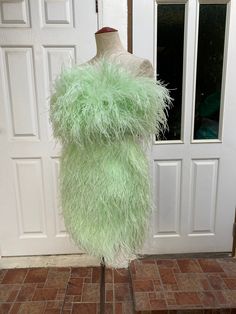 "Miki light green ostrich feather mini dress cocktail dress -Made to order -Please check my sizes chart before ordering -If it's doesn't fit with my size chart please measure your bust waist and hips -Dress made with ostrich feathers -Zipper closure on the back side -Straps can be taken off -Color: more than 18 colors -Dry clean only SGinstar Size Guide UK4/US0/EU32/AU4 Bust 31\"(78cm.) Waist24\"(60cm.) Hips33\"(83.5cm.) UK6/US2/EU34/AU6 Bust32\"(80.5cm.) Waist25\"(63cm.) Hips34\"(86cm.) UK8/US4 Elegant Prom Dress With Ostrich Feathers, Fitted Mini Dress With Ostrich Feathers, Green Mini Dress For Wedding And Prom Season, Chic Light Green Mini Dress For Party, Feather Detailed Mini Dress For Prom Season, Feather Trim Mini Dress For Prom, Feather Trim Mini Dress For Prom Season, Feathered Mini Dress For Prom Season, Strapless Mini Dress With Feather Trim For Prom