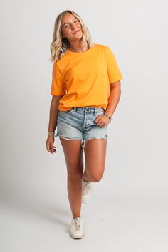 Basic short sleeve t-shirt from Lush Fashion Lounge women's boutique in Oklahoma City. Lush boutique in OKC has a variety of cute basic tops and more! This trendy basic t-shirt is a must have! Pair this basic orange top with shorts and sneakers for a cute and casual look! Model is 5'4 size 26 wearing size small. 100% cotton Casual Plain T-shirt For Spring, Trendy Short-sleeved T-shirt In Solid Color, Trendy Short Sleeve Solid Color T-shirt, Basic Short Sleeve Top For Spring, Relaxed Fit Solid Color T-shirt For Spring, Orange Solid Color Summer Tops, Basic Solid Color Short Sleeve Tops, Orange Short Sleeve Solid Color Tops, Basic Short Sleeve Solid Color Tops