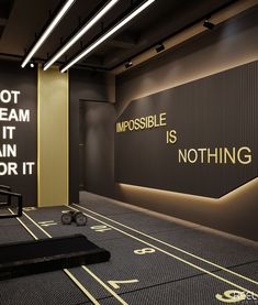 an empty room with a sign that says impossible is nothing