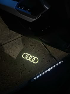 an illuminated sticker on the side of a car