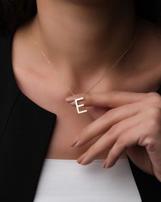 "14k Solid Gold Personalized Letter Necklace is a simple elegant jewelry that you can buy for yourself or your loved ones. This custom monogram necklace can be a special best friend gift or a birthday gift for her. Note: \"E\" letter necklace is used as an example for product photos. Please specify the letter you want at the time of purchase. * Necklace length: 16,5\" (42 cm) * Necklace weight: Approx. 1,97 grams * Pendant width: 0,3\" (0,9 cm)  * Pendant height: 0,6\" (1,5 cm) * There may be 10% -) deviation margin in the weight of the necklace. * Temiroglu Gold products are real solid gold. It is definitely not gold plated, not gold filled. * All products are presented to you in high quality jewelry boxes. * Depending on your request, we can provide delivery in the form of a gift package Elegant Everyday Name Necklace With Initials, Elegant Everyday Initials Name Necklace, Elegant 14k Gold Initial Necklace For Personalized Gift, Minimalist Initial Pendant Name Necklace For Formal Occasions, Minimalist Formal Initial Pendant Name Necklace, Minimalist Formal Name Necklace With Initial Pendant, Formal Minimalist Initial Pendant Name Necklace, Modern Yellow Gold Initial Necklace Gift, Minimalist Initials Necklace For Formal Occasions