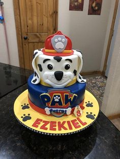 a birthday cake with a dog on top