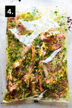 a bag filled with meat and vegetables on top of a table