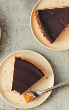 two plates with slices of chocolate pie on them