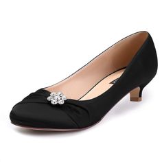 a black shoe with a bow on the toe and heels that are made from satin fabric