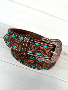 Western style turquoise buckstitch, leather tooled belt with removable copper buckle (screw on) sizes: All are 1.5" wide  Small 29"-32" Medium 32"-36" Large 36"-40" XL 40"-44" Buckle is removable with screws** handmade by Bar H Equine  Not customizable Luxury Hand Tooled Western Belts, Sunflower Leather Belt, Hand Tooled Leather Belts For Western-themed Events, Tooled Sunflower, Western Belts For Women Coolbuckles.biz, Tooled Belt, Leather Tool Belt, Turquoise Belt Buckle, Western Jeans