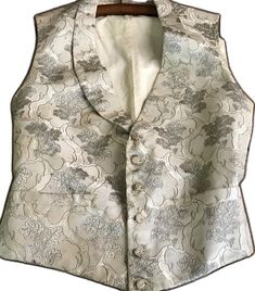 Elegant Wedding Vest With Buttons, Elegant Fitted Silk Vest, Formal Silk Fitted Vest, Formal Beige Vest With Buttons, Formal Fitted Silk Vest, Silk Fitted Vest For Formal Occasions, Elegant Fitted Vest For Costume, Festive Formal Fitted Vest, Vintage Formal Vest With Buttons