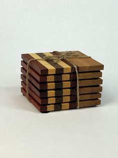 a stack of wooden coasters tied with twine