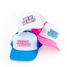 three hats with the words we like to party written on them, all in different colors