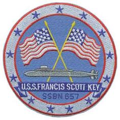 the ussfrancis scott key logo with two crossed american flags on one side