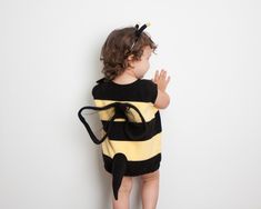 "Bumble Bee Costume, Toddlers Halloween Costume, Party Costume, Girl Halloween Costume, Toddler Bee Costume, Bumblebee Bumblebee costume, great for a boy or a girl. The costume consists of a vest and a headband. Can be worn with a t-shirt or a long sleeved shirt underneath. SIZE GUIDE: 1.5 - 2 years Height 31\" - 34\" or 79 cm - 86 cm 3 - 4 years Height 37\" 1/2 - 40\" 1/2 or 95 cm - 103 cm 5 - 6 years Height 43\" or 45\" 1/2 or 109 cm - 115.5 cm 7 - 8 years Height 48\" - 50\" 1/2 or 122 cm - 12 Toddler Bee Costume, Bee Costume Diy, Caterpillar Costume, Bumble Bee Costume, Bug Costume, Halloween Costumes To Make, Costume Toddler, Baby Bug, Bee Costume