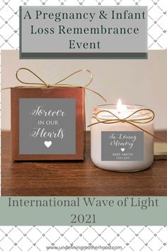 the international wave of light candle is displayed next to a box with a heart on it