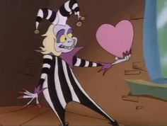 a cartoon character holding a heart shaped object in one hand and wearing striped clothing on the other