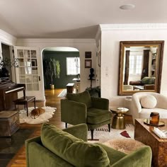 a living room filled with furniture and a large mirror