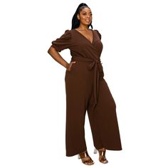 This jumpsuit combines fashion and function, boasting a flattering surplice top, convenient pockets, and a waist tie that accentuates your curves. The wide legs add a touch of sophistication, while the pull-on closure ensures comfort and ease. Pocket Jumpsuit, Surplice Top, Slim Fit Shorts, Elbow Sleeve, Wide Legs, Full Figured, Workout Tank Tops, Waist Tie, Fabric Care