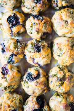 blueberry muffins are arranged on a baking sheet