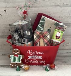 a red bucket filled with lots of holiday treats