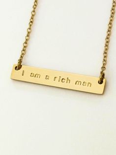 I am a Rich Man Cher Quote Gold Necklace | Engraved personalised name bar | Waterproof Jewellery | Feminist Empower Silver Word Bar Chain  This the stunning bar necklace with the infamous Cher words! A perfect gift for someone who needs a little lift ❤️ Comes in both silver and gold with a choice of 2 lengths - 19'' or 23''. It is PVD plated making it waterproof and tarnish free.  Please note if you choose Personalisation, the wording you input will replace the original necklace wording aka I am Cher Quotes, I Am A Rich Man, Feminist Necklace, Original Necklace, Waterproof Jewelry, Rich Man, Engraved Necklace, Infamous, Wax Seals