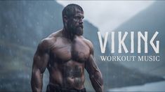 a man standing in the rain with his shirt off and words viking workout music above him