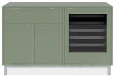 a green cabinet with two doors and three drawers on the front, one door open