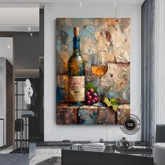 a wine bottle and two glasses on a table in front of a wall with an abstract painting