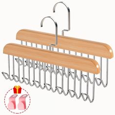 three wooden hangers with hooks on each side and one hanging over the other in different positions