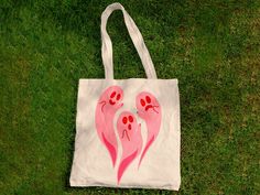 "Cute tote bag for the halloween girlies. - Made with 100% cotton sheeting - Reinforced handle stitched into bag! - Practical and durable - A reliable and stylish way to carry your belongings!  Material: 100% cotton  - Lightweight and compact  - Handle Length: 21.5\"  - One size only Height: 15.75 inches Width: 15.25 inches Handle Length: 21.5 inches" Diy Halloween Tote Bag, Fun Pink Cotton Bag, Fun Cotton Tote Canvas Bag, Creative Tote Bag, Ghost Tote Bag, Totes Ideas, Fall Tote Bag, Fall Tote, Ghost Diy