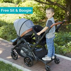 a young boy standing next to a stroller with the text free sit & boogie on it