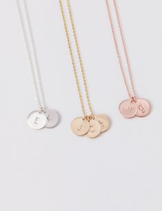 Small discs necklace - a dainty, classic, and minimalist necklace that can be personalized with one or several of the initials of your most favorite people. D E T A I L S * Disc size is approximately 9 mm in diameter, 0.9mm thick * Available in 14k gold fill, sterling silver, or 14k rose gold fill * This listing is for one necklace P R O M O T I O N * Bridesmaids gifts: message us for a coupon code * New FACEBOOK or INSTAGRAM followers: follow us in the links below then message us for a 10% off Stamped Initial Pendant Necklace For Personalized Gift, Personalized Stamped Round Disc Charm Necklaces, Personalized Stamped Round Disc Charm Necklace, Personalized Initial Pendant Coin Necklace For Gift, Personalized Dainty Medallion Charm Necklaces, Customizable Silver Initial Necklace For Everyday, Personalized Dainty Medallion Charm Necklace, Dainty Personalized Medallion Charm Necklaces, Personalized Stamped Round Charm Necklace