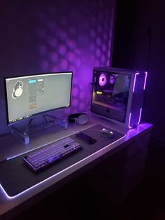 a desktop computer sitting on top of a desk next to a keyboard and mouse in front of a monitor