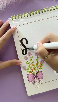 a woman is drawing numbers on a notepad